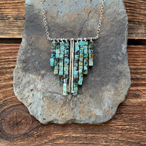 African turquoise waterfall necklace. Raw turquoise beads and accents of silver.